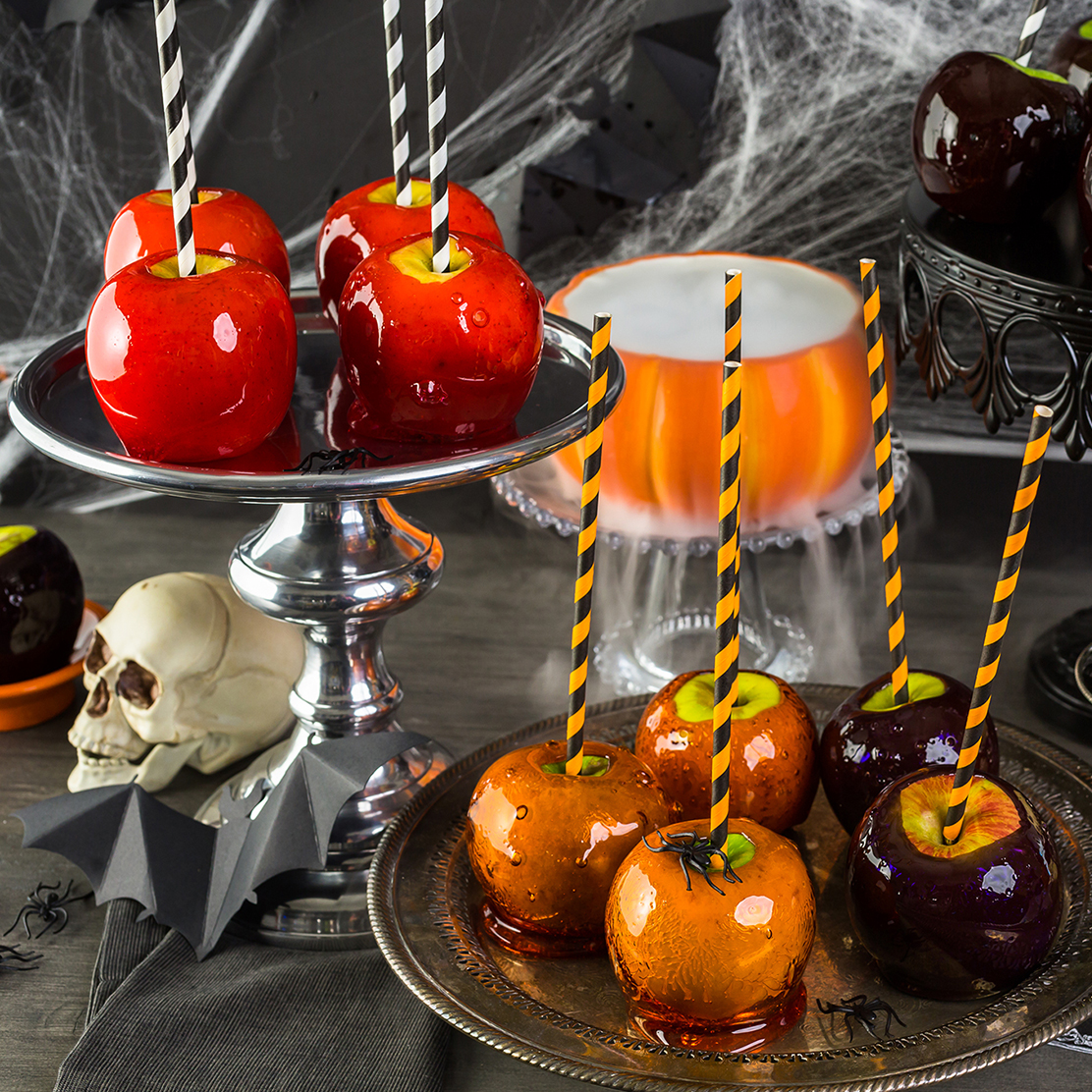 Sweet treats on Halloween can wreak havoc on children's dental health, so get creative about what you hand out. This is a decorative image of Halloween-themed treats on a table.