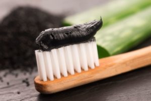 Potential dangers of charcoal toothpaste include dental erosion and gum irritation.